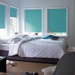 Turquoise roller blinds in the bedroom