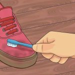 Cleaning sneakers with a brush