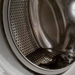 What to do if there is water left in the washing machine drum after washing clothes?