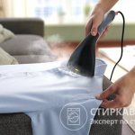 Ironing a shirt using a steamer