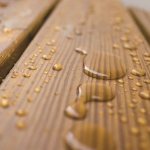 Drops of fresh resin on boards in a bathhouse