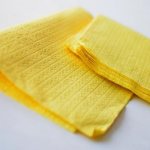yellow hand napkins lie