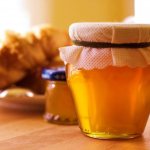 fresh honey in a closed jar on the table