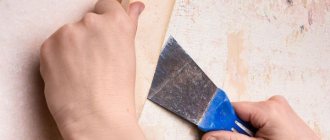 Removing wallpaper using a spatula