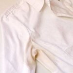 Yellow sweat stain on a white shirt